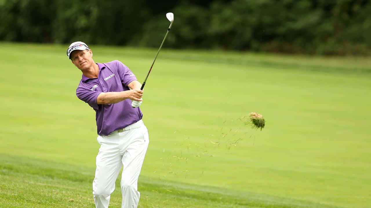 John Senden Executing Divot Shot Background