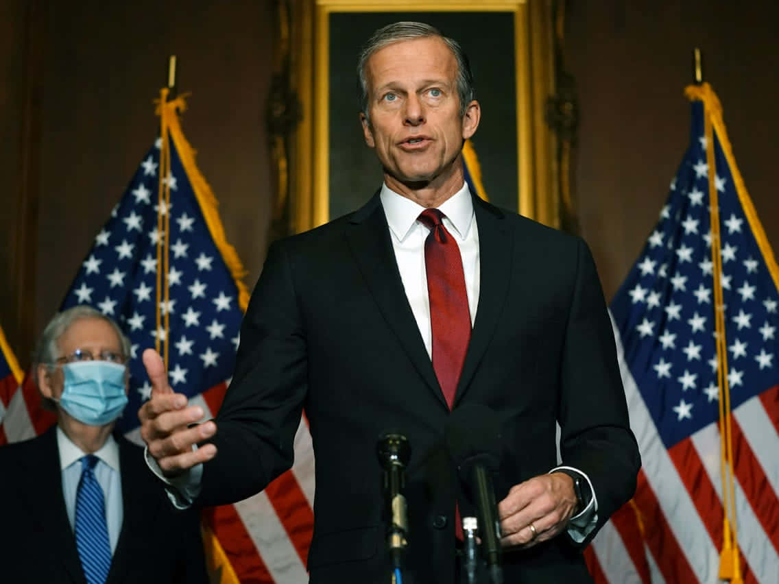 John Thune In A Confident Pose Background