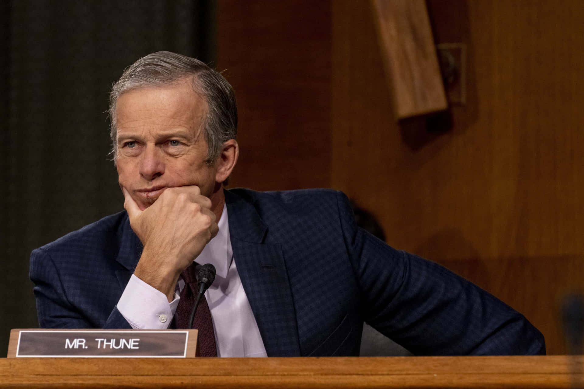 John Thune In A Thoughtful Pose Background