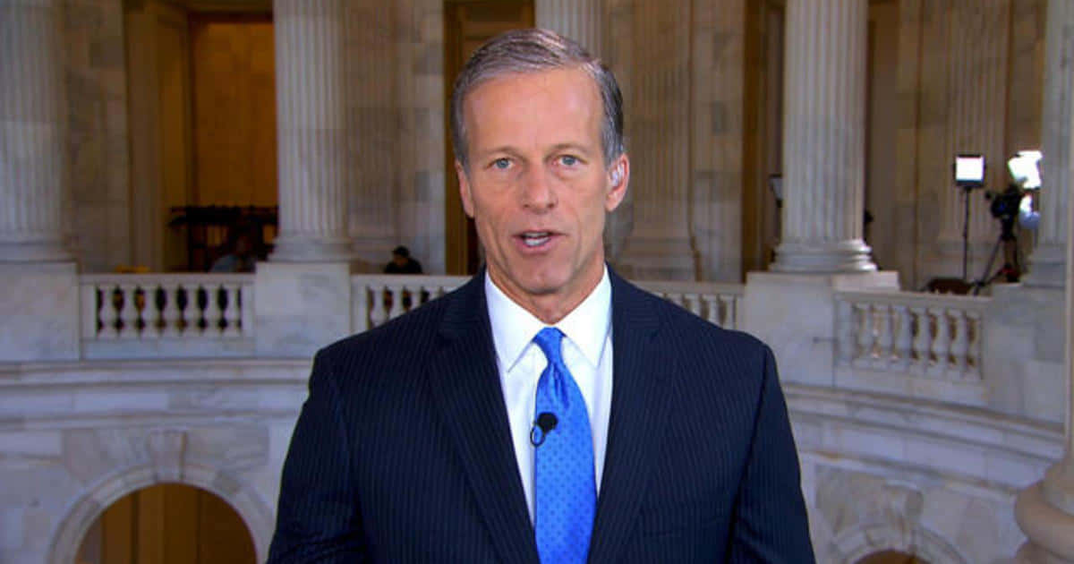 John Thune Looking At The Camera Background
