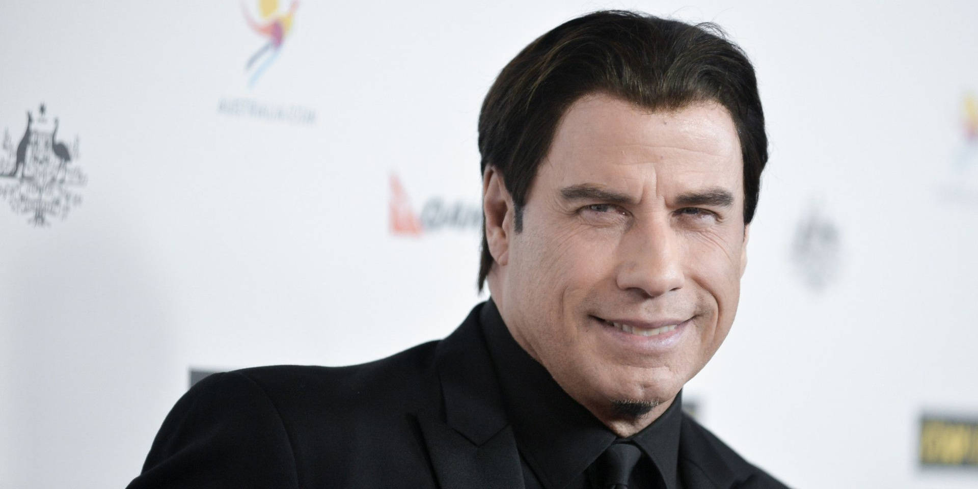 John Travolta Wide Smile Awards Night Background