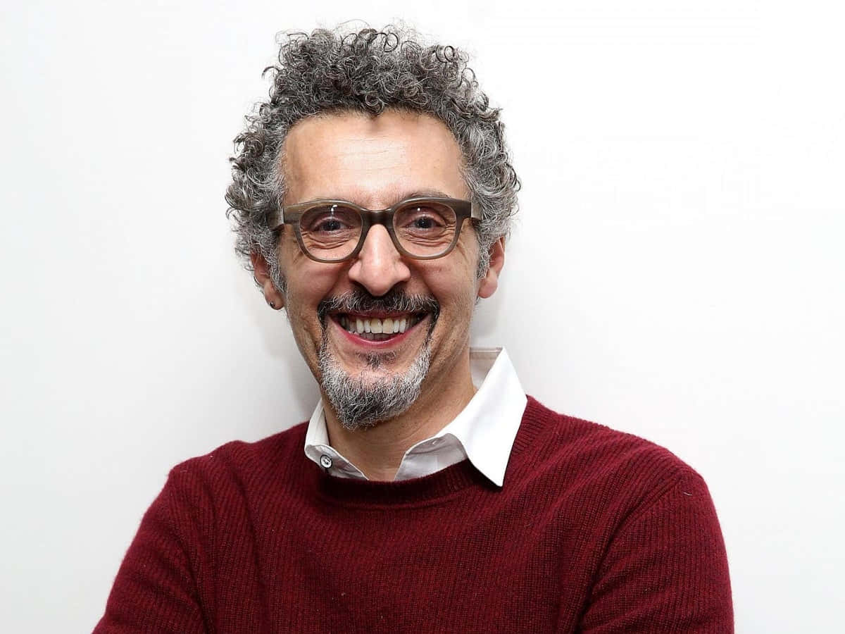 John Turturro In His 1980s Prime Background
