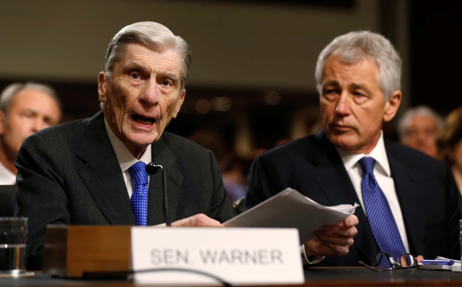 John Warner Addressing A Gathering. Background