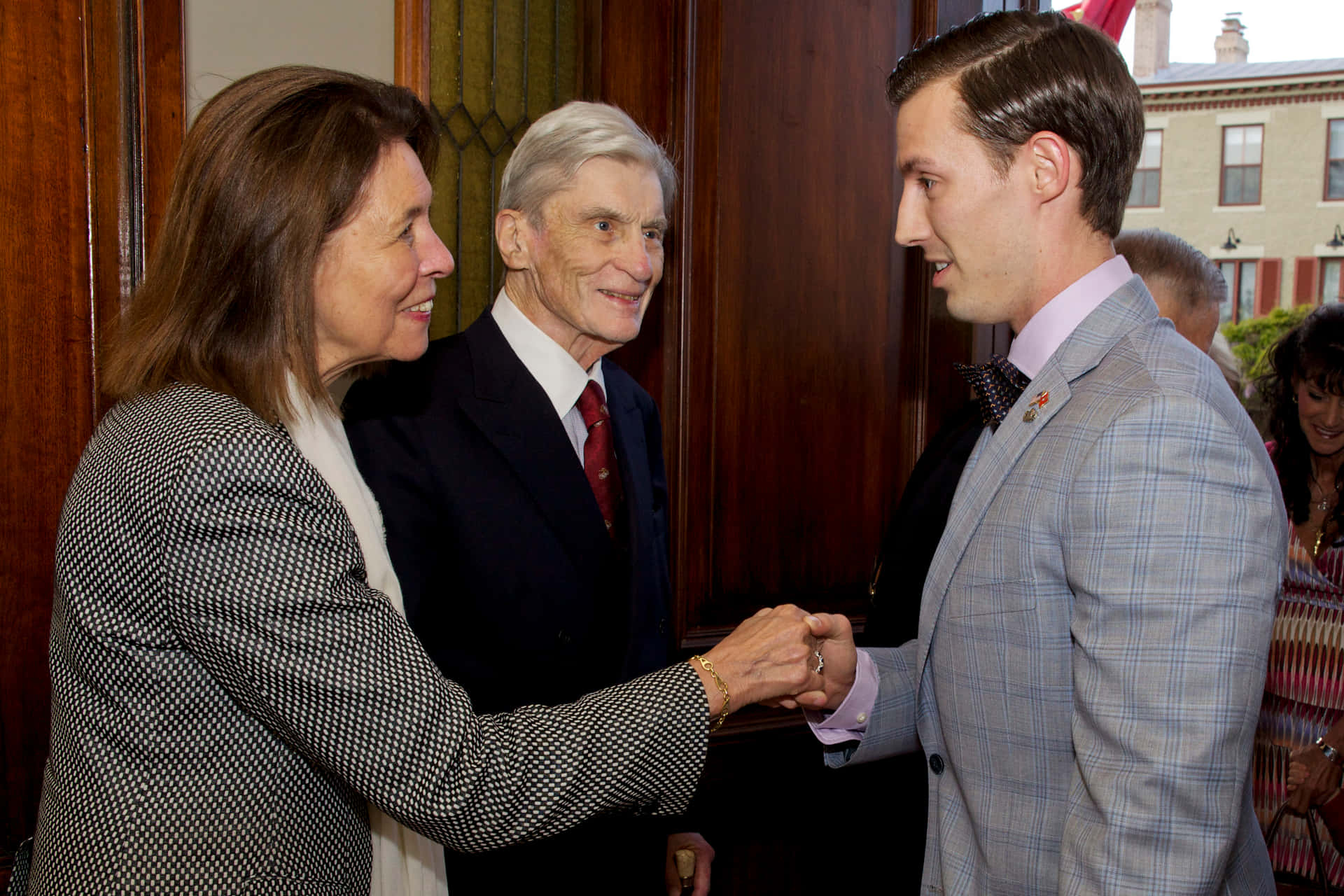 John Warner Shaking Hands With Jeanne Vander Myde Background