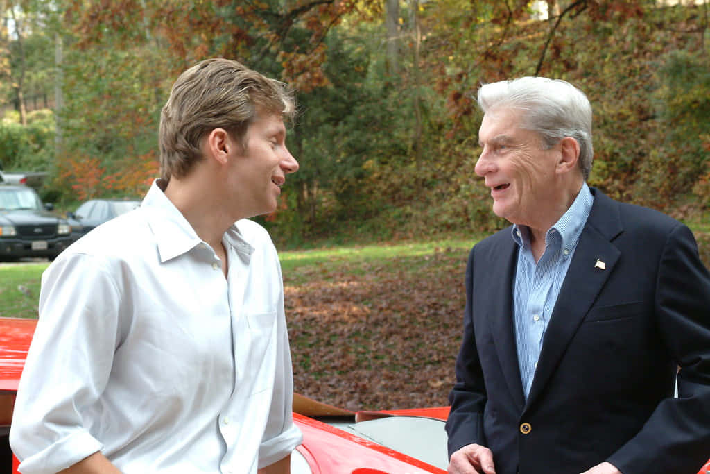 John Warner Smiling With His Son Desktop Background