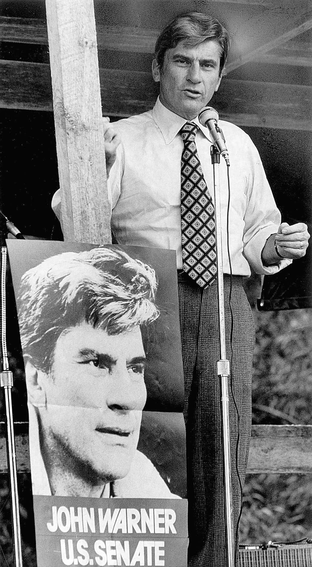 John Warner With Poster Black And White Phone Background