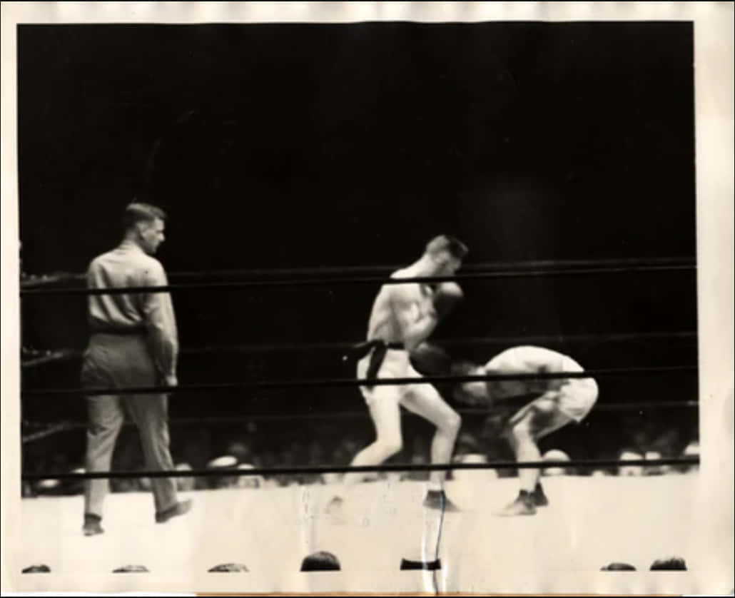 Johnny Dundee Bending Down At The Fight Background