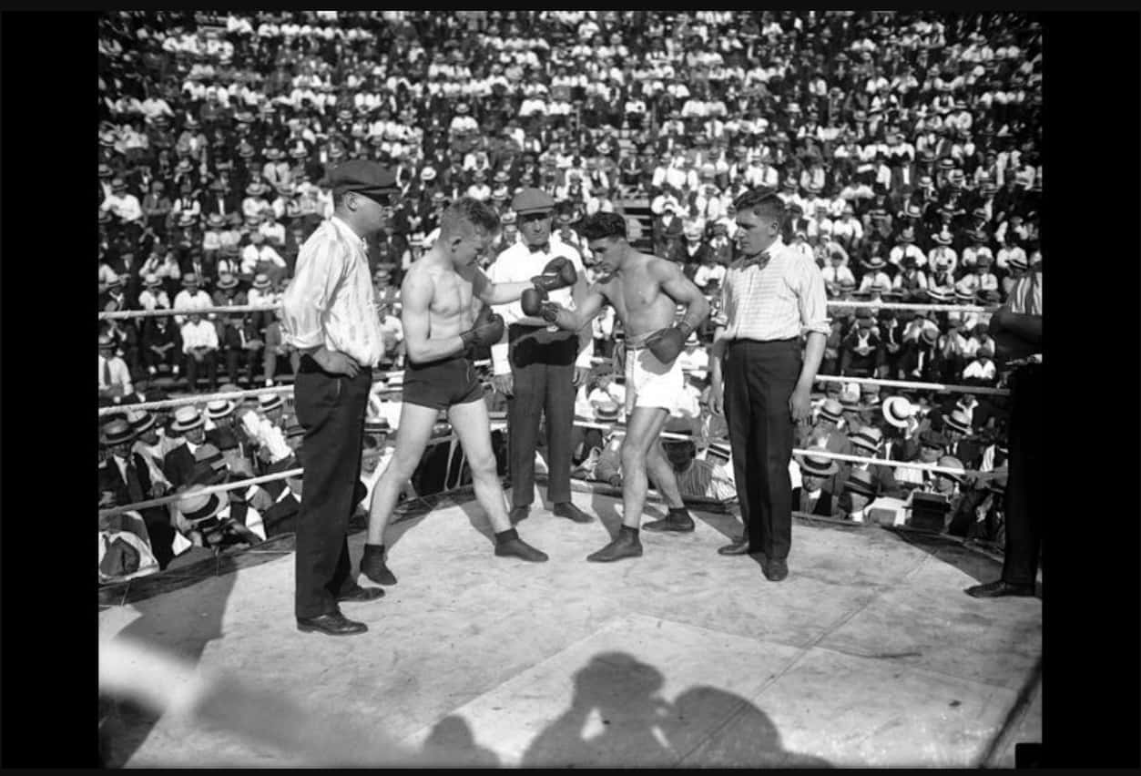 Johnny Dundee's Boxing Fight With A Huge Crowd Background