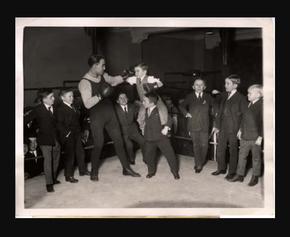 Johnny Dundee Training Boxing With Cute Kids Background