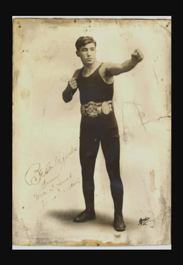 Johnny Dundee Wearing A Bodysuit Background