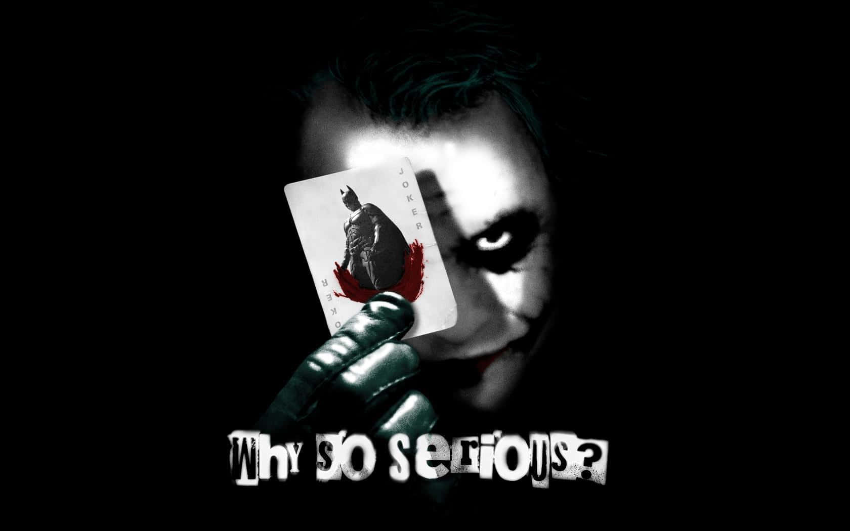 Joker Holding A Card With A Why So Serious Quote Background
