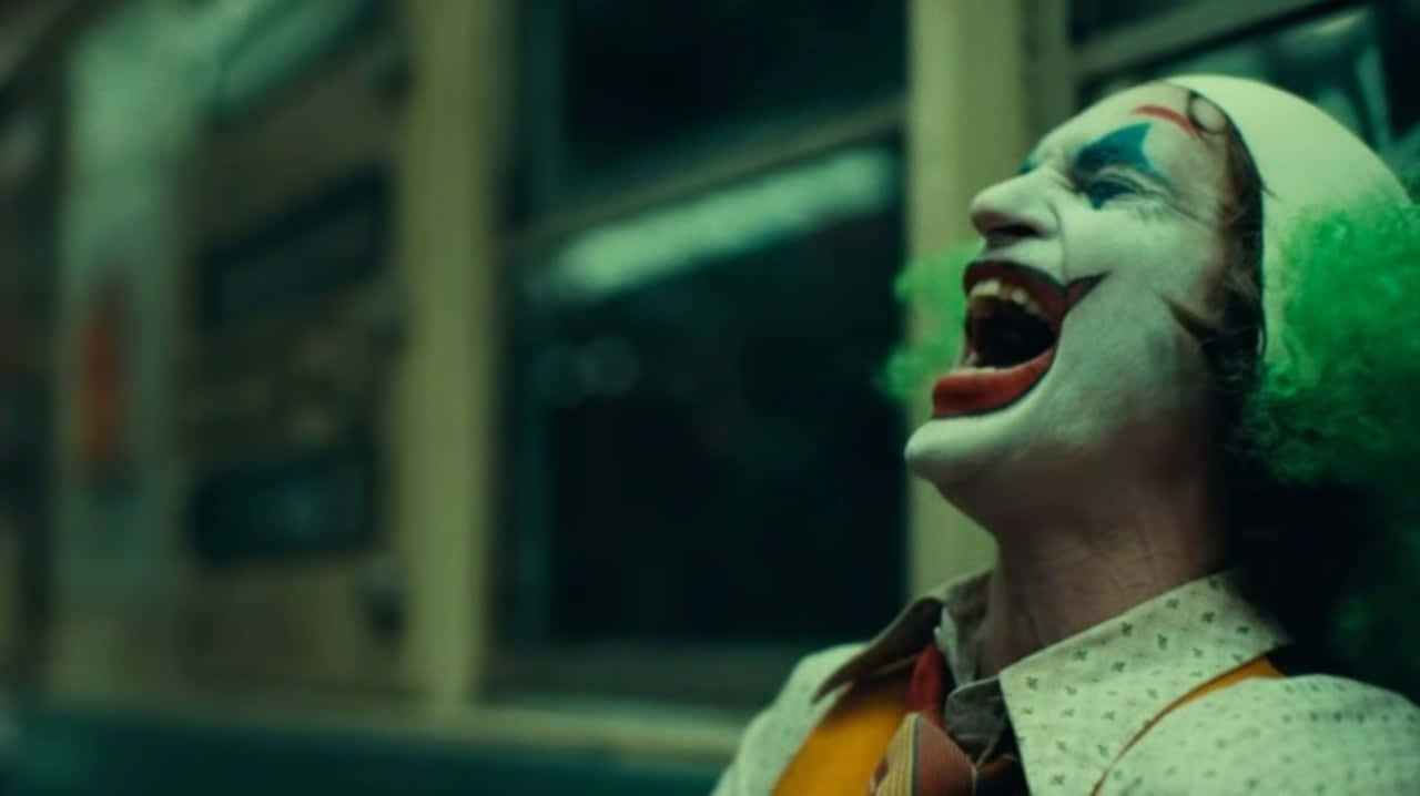 Joker Laughing In The Dark Background