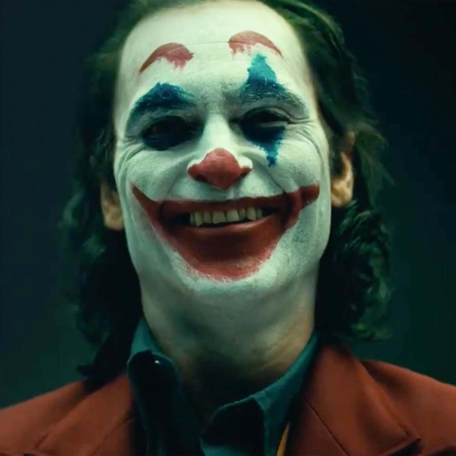 Joker Laughing Maniacally In The Dark