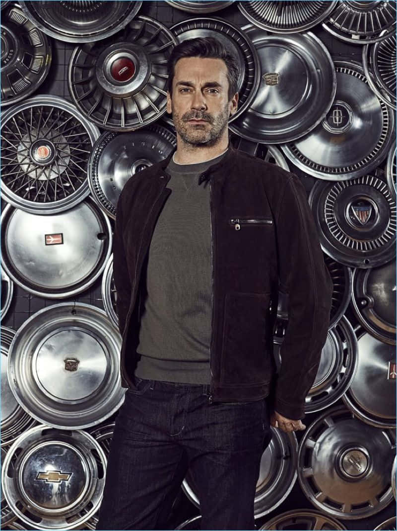 Jon Hamm Looking Suave In A Suit Background