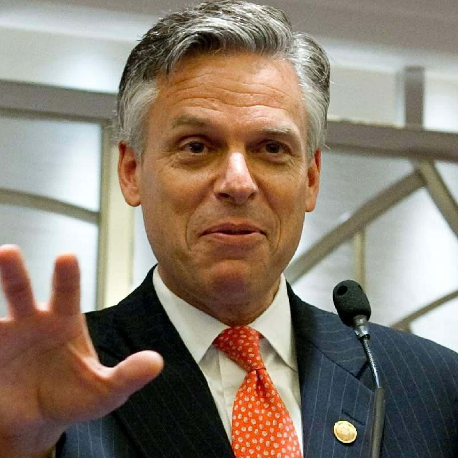 Jon Huntsman Smiling At The Camera Background