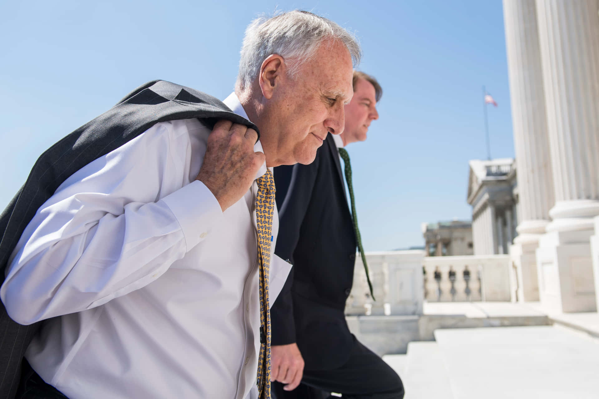 Jon Kyl Going To Us Capitol Background