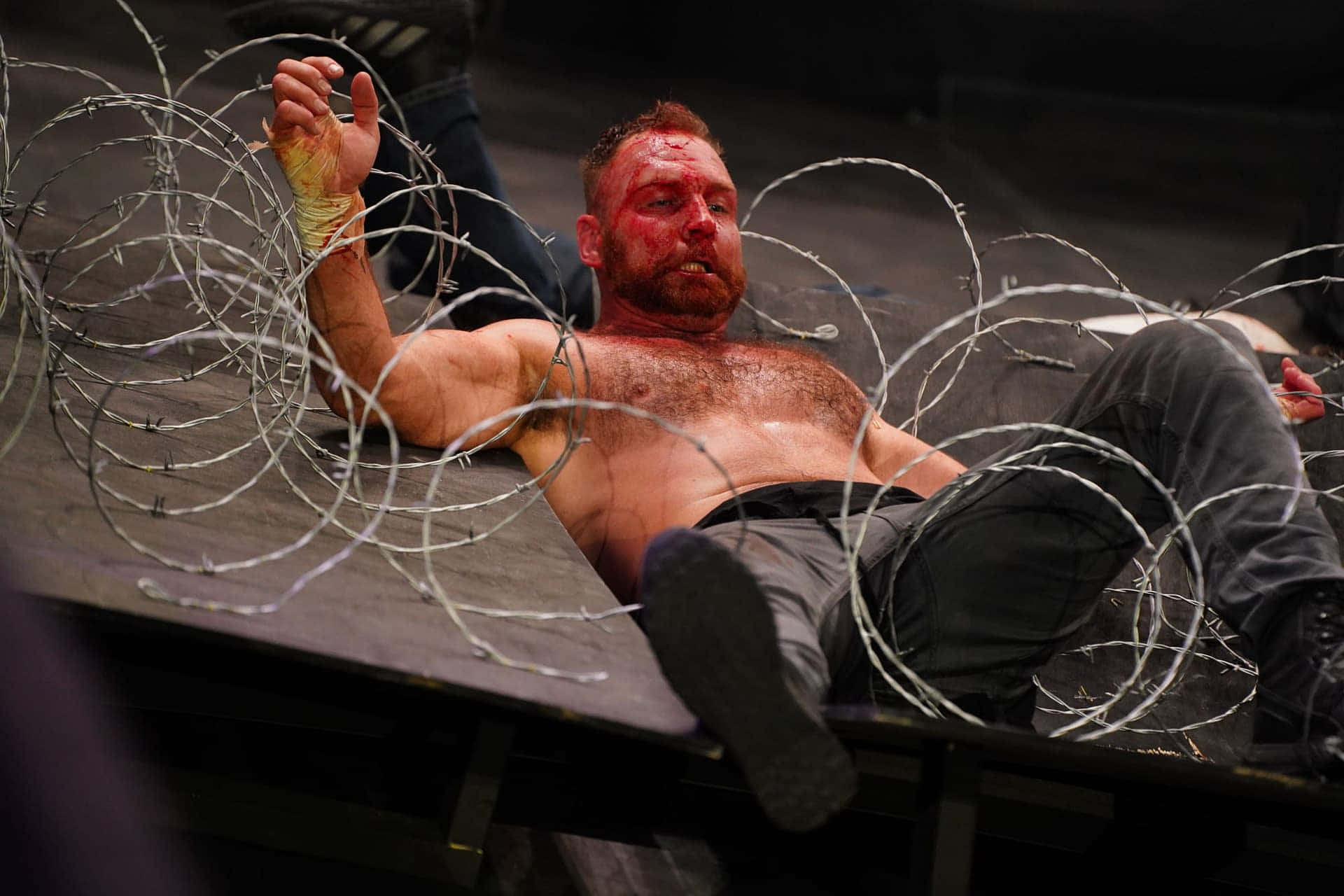 Jon Moxley Displaying His Intense Wrestling Fury Background