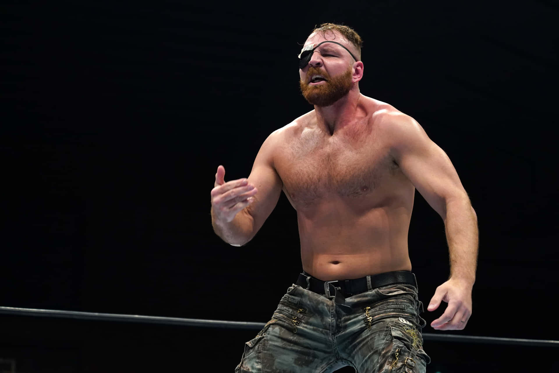Jon Moxley Pops With Striking Eyepatch - Portrait Action Shot Background