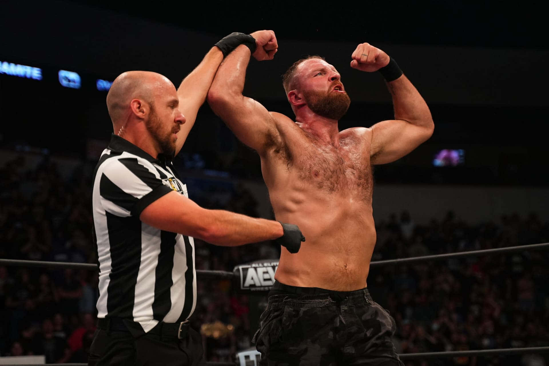 Jon Moxley Winning Pose Background