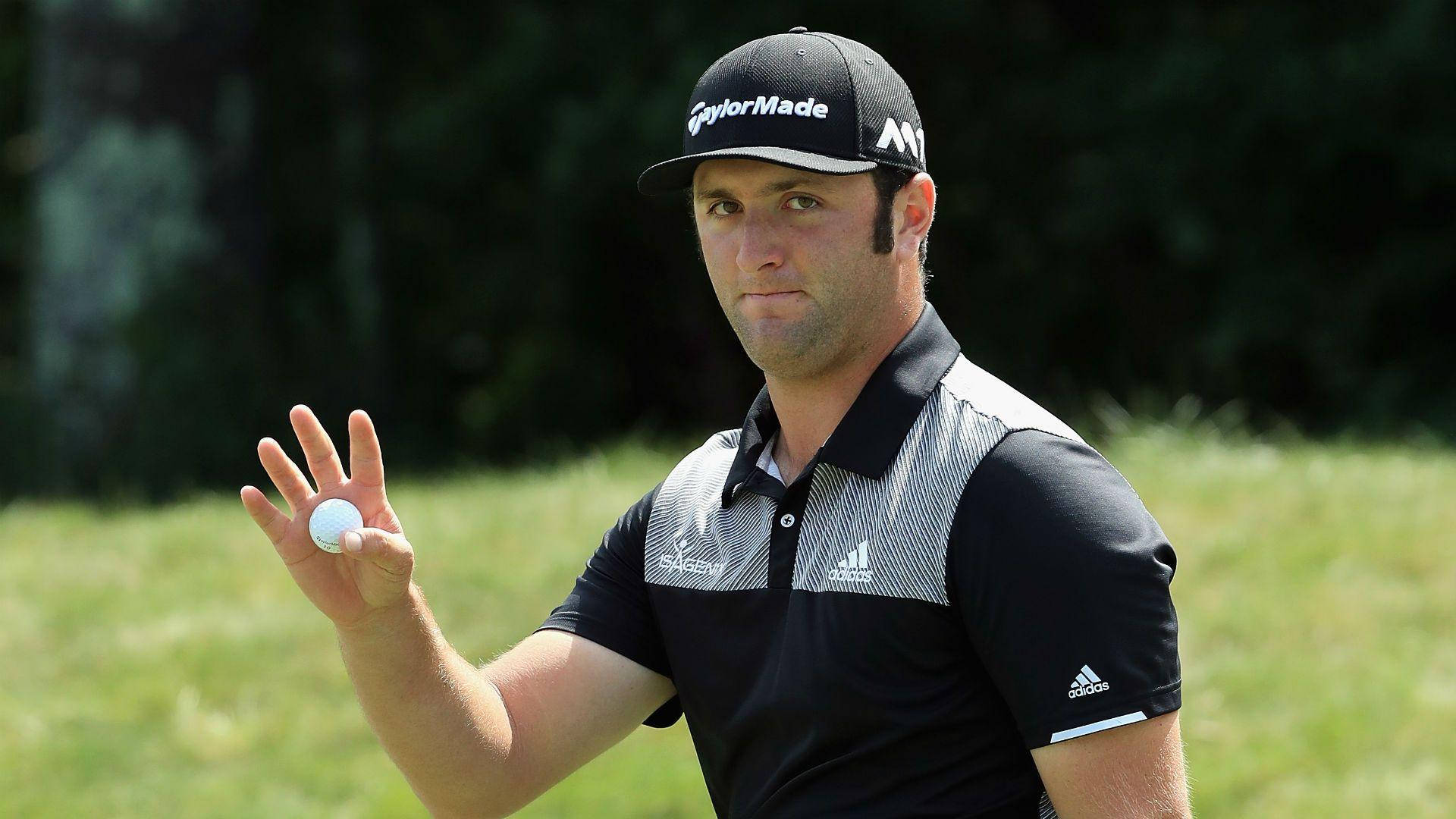 Jon Rahm Holding A Golf Ball