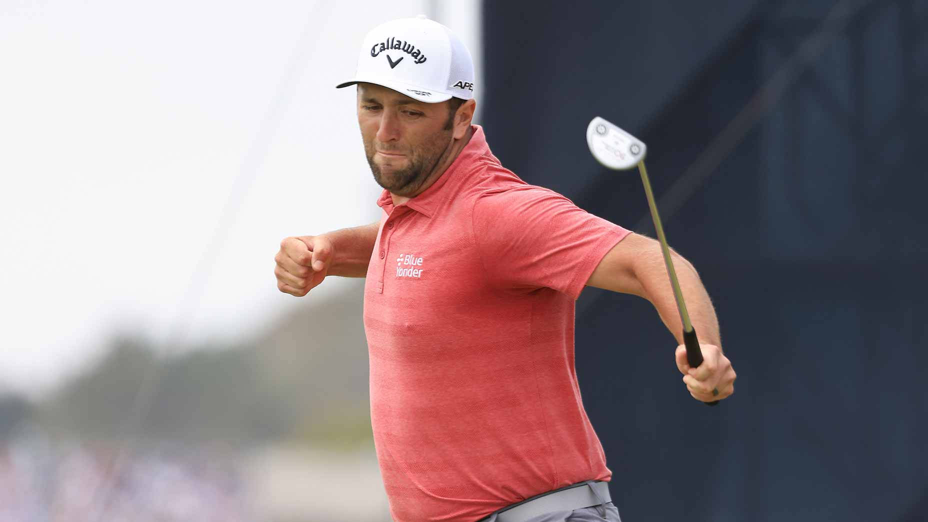 Jon Rahm Jumping For Victory Background