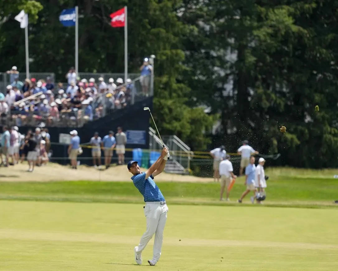 Jon Rahm With His Golf Club Background