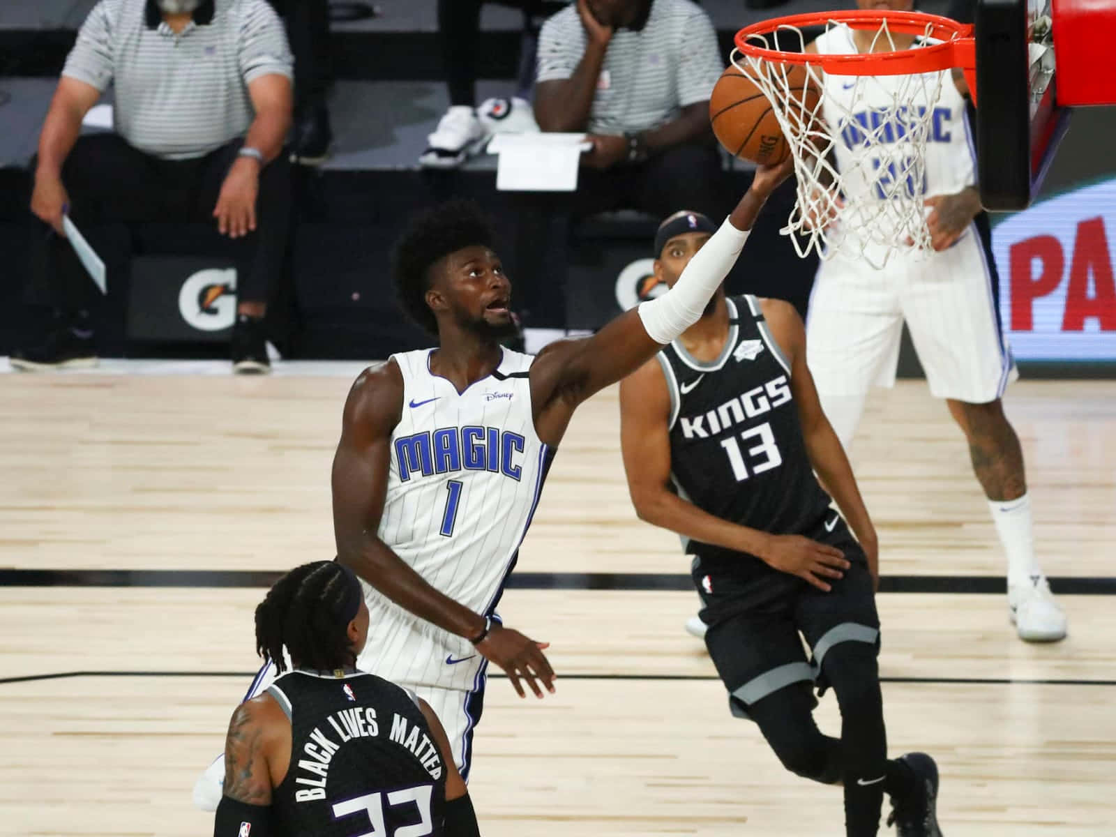 Jonathan Isaac Reaching Basketball Ring Background