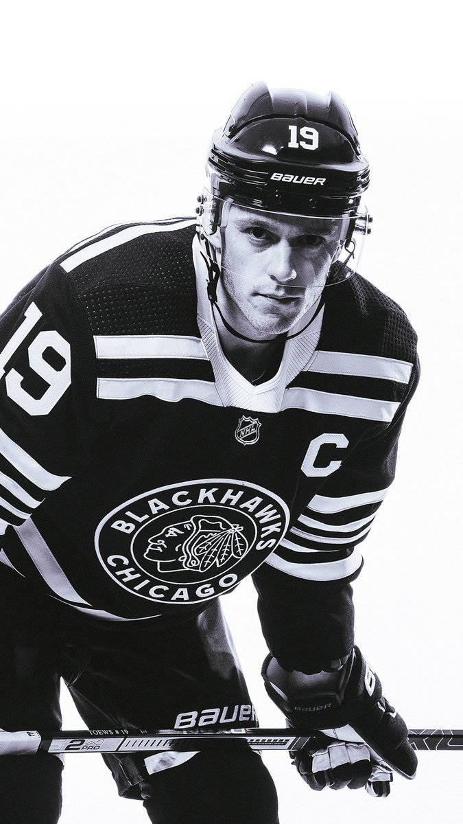 Jonathan Toews In Action - Ice Hockey Champion And No. 19 Player For The Blackhawks Background