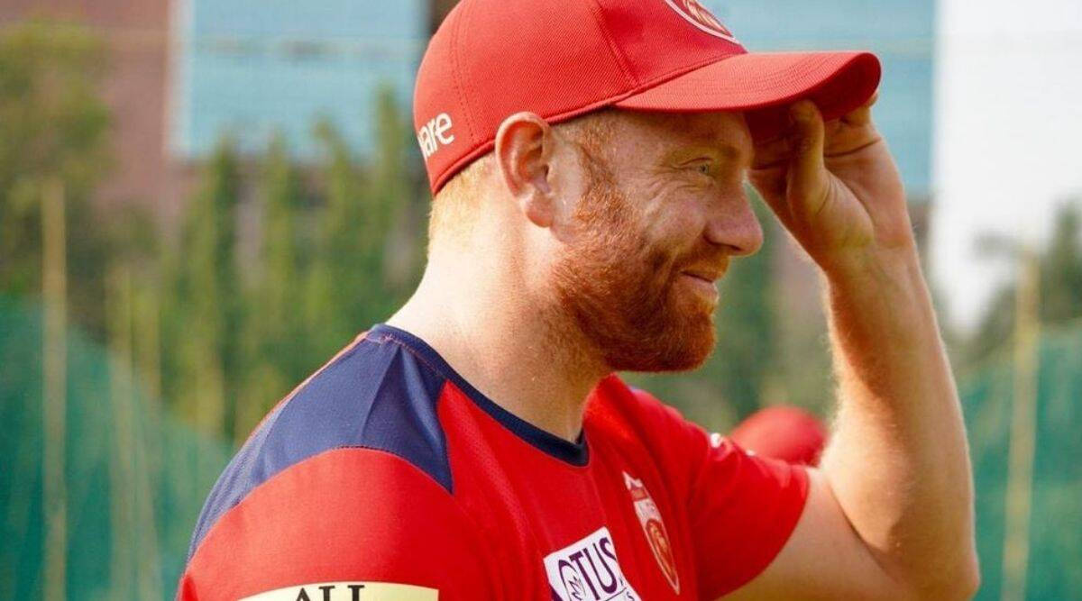 Jonny Bairstow Side Profile In Red Cap Background