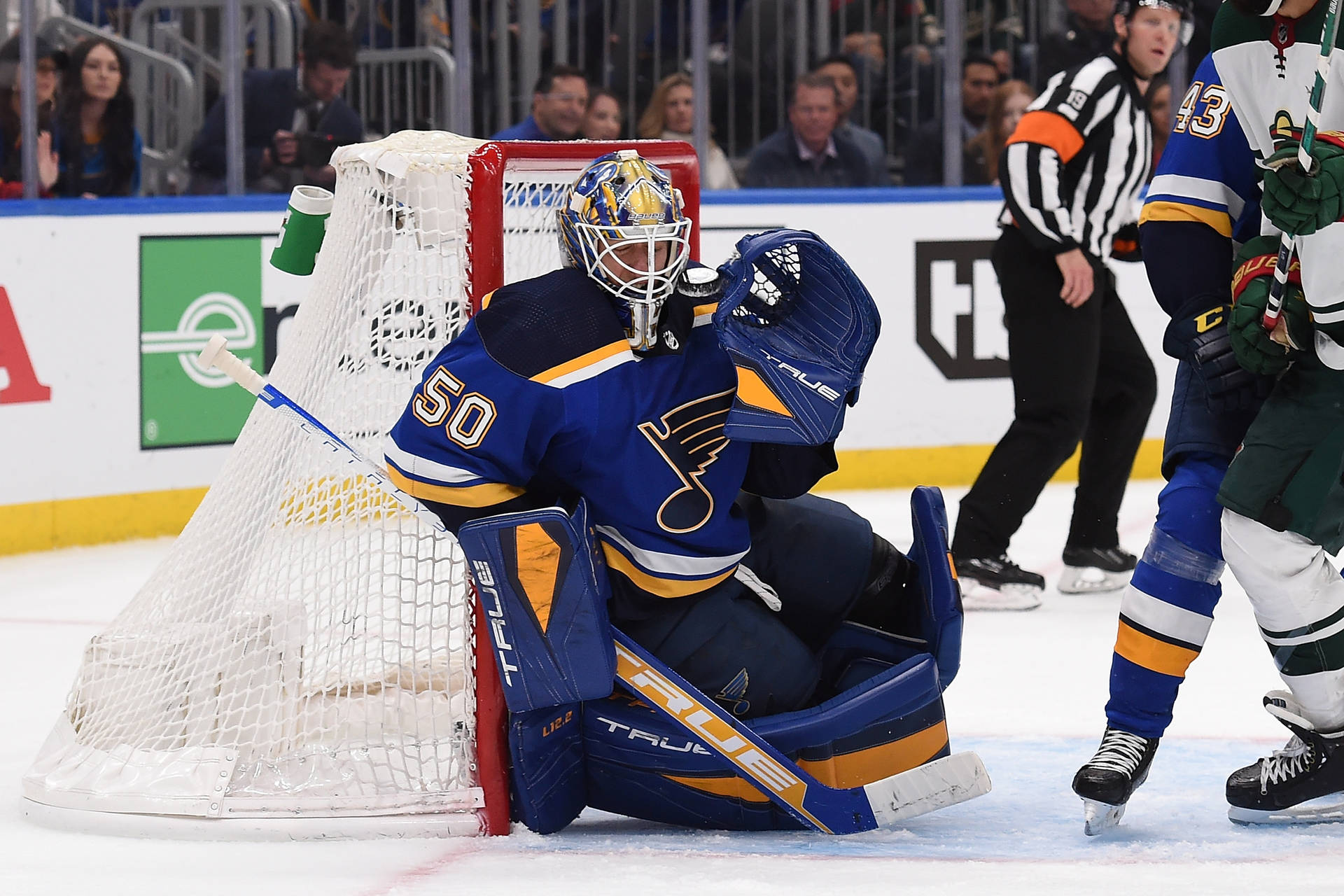 Jordan Binnington In Action, Showing His Defensive Skills In The Hockey League Background