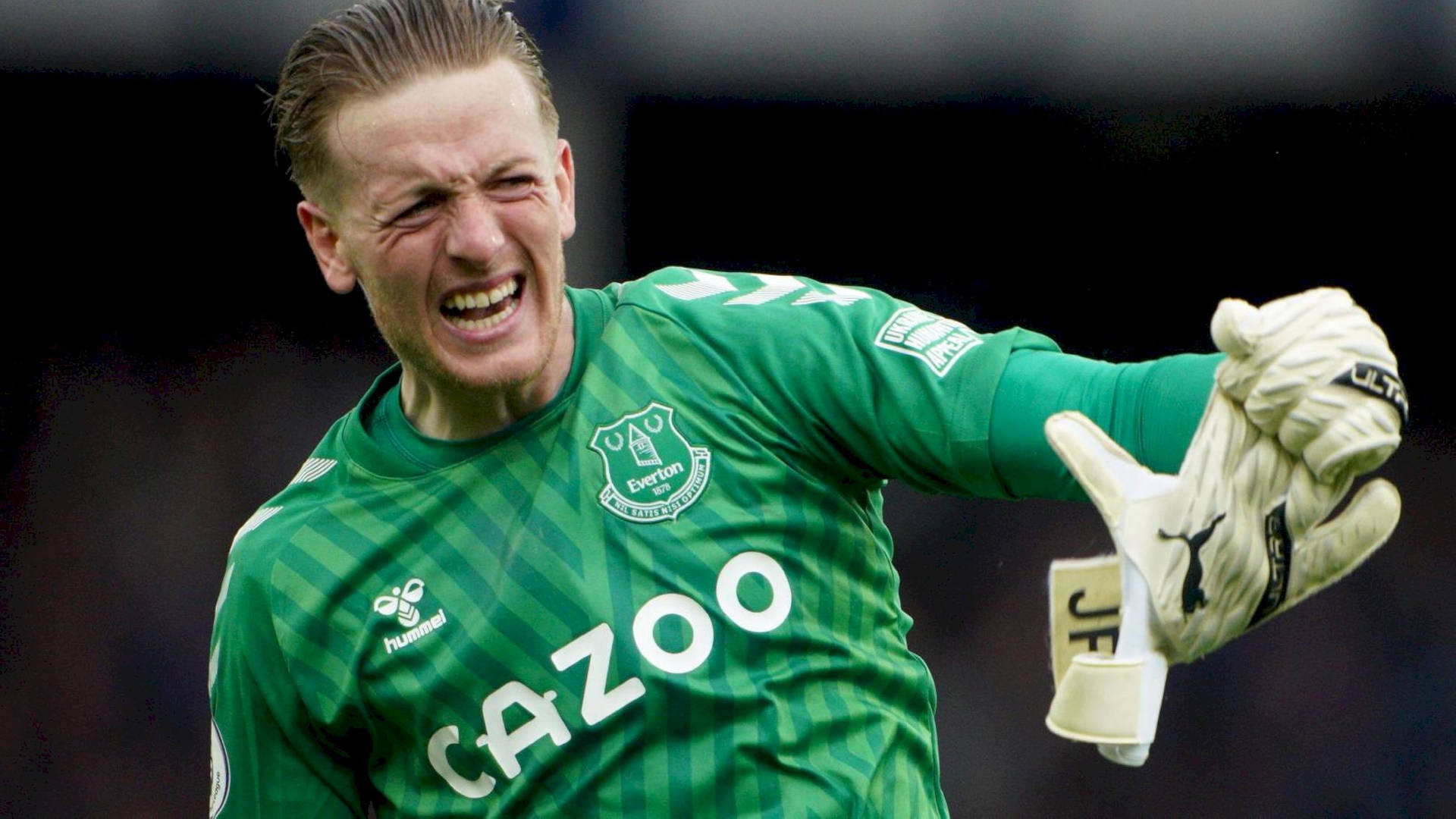 Jordan Pickford Holding A Glove Background