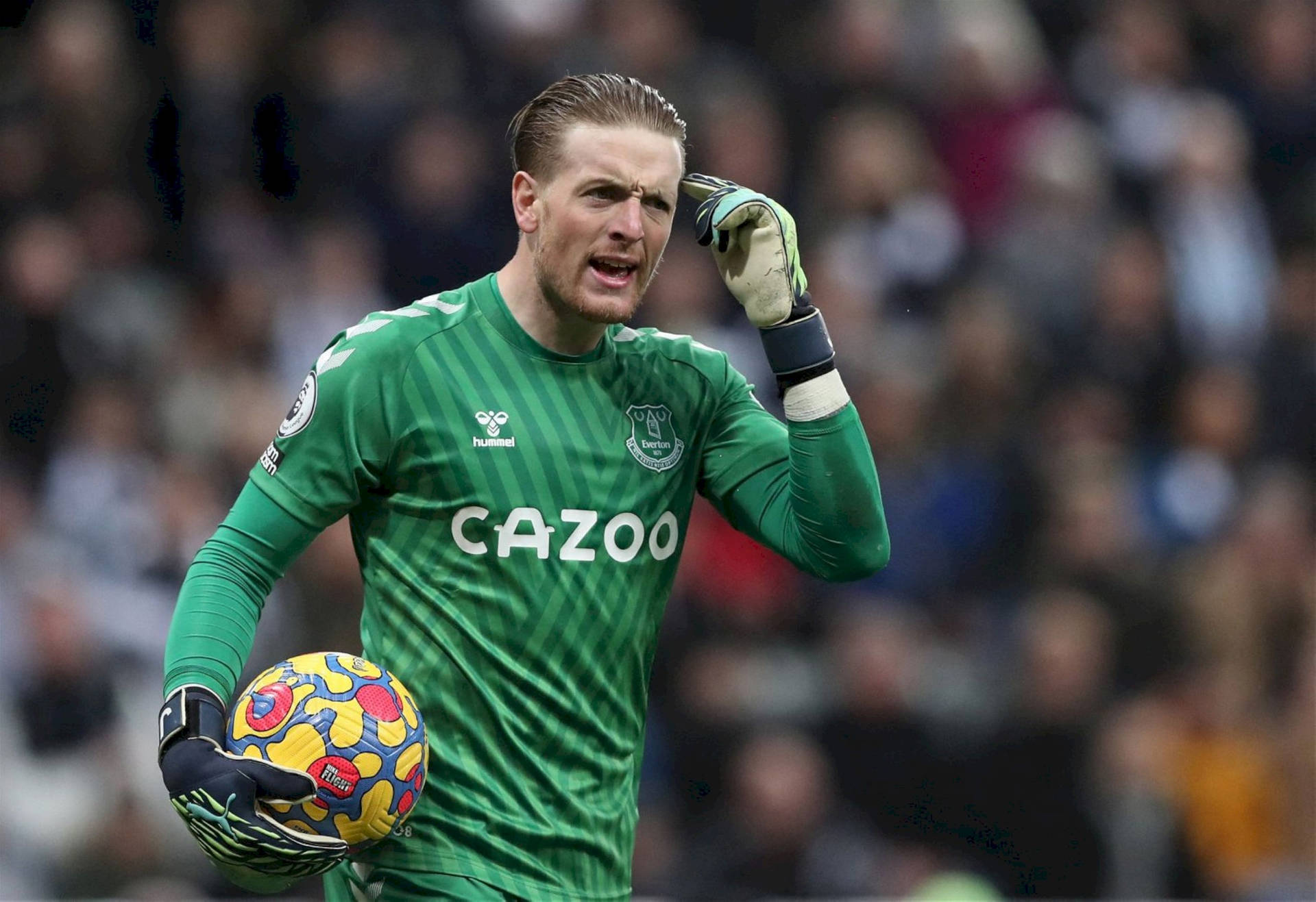 Jordan Pickford Holding Colorful Football Background