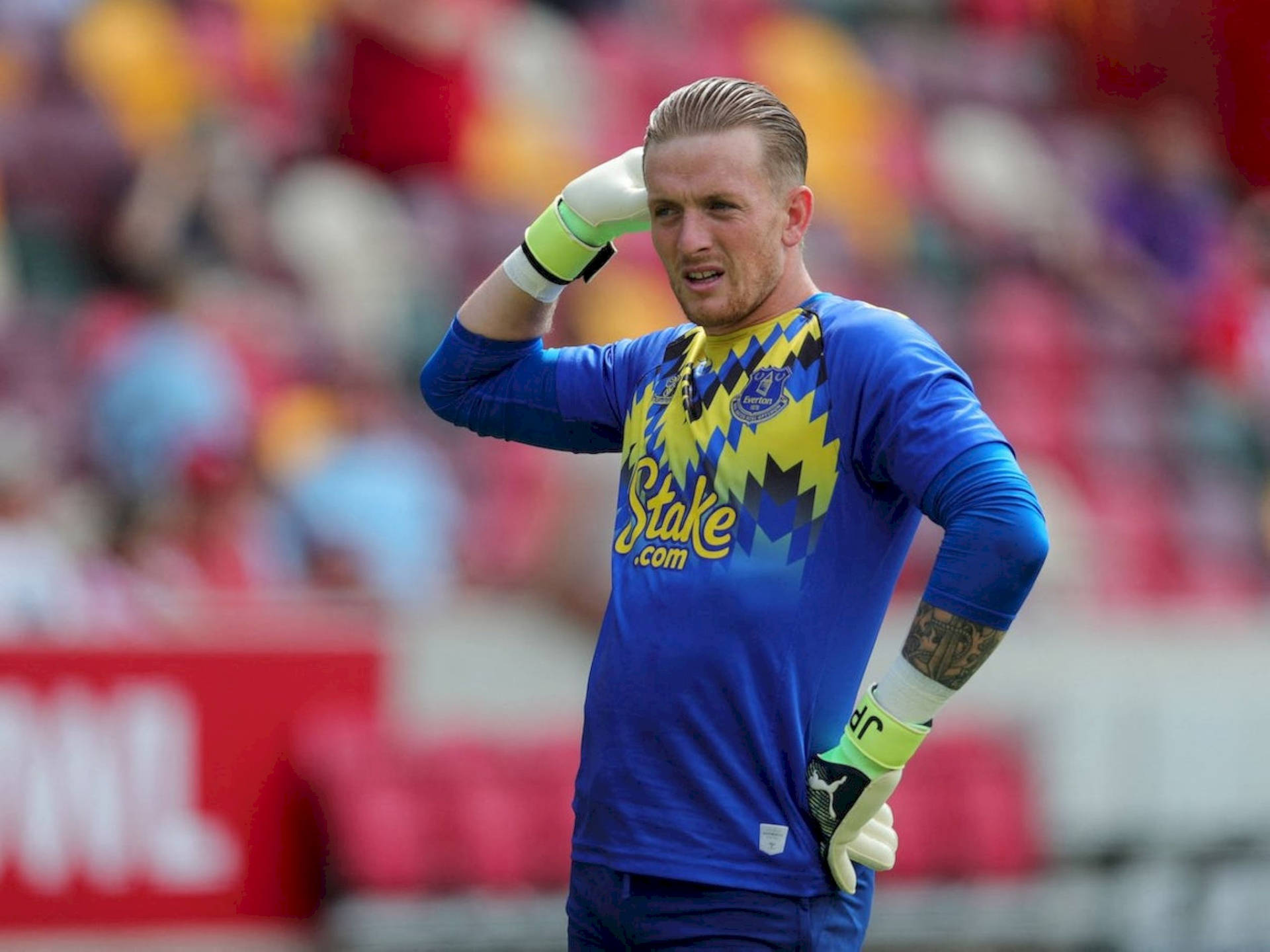 Jordan Pickford Posing In Blue Jersey Background