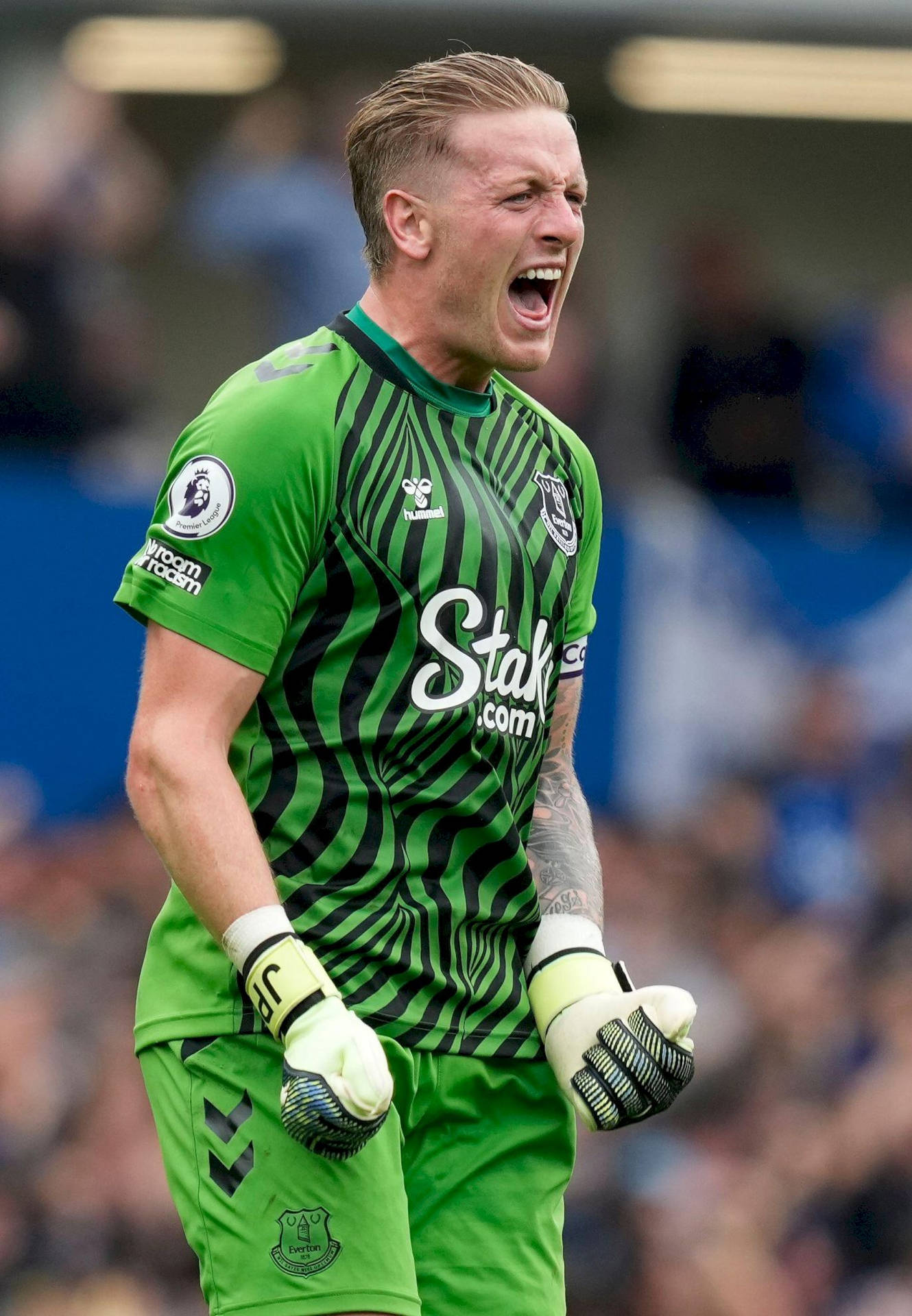 Jordan Pickford Shouting In Green Uniform Background