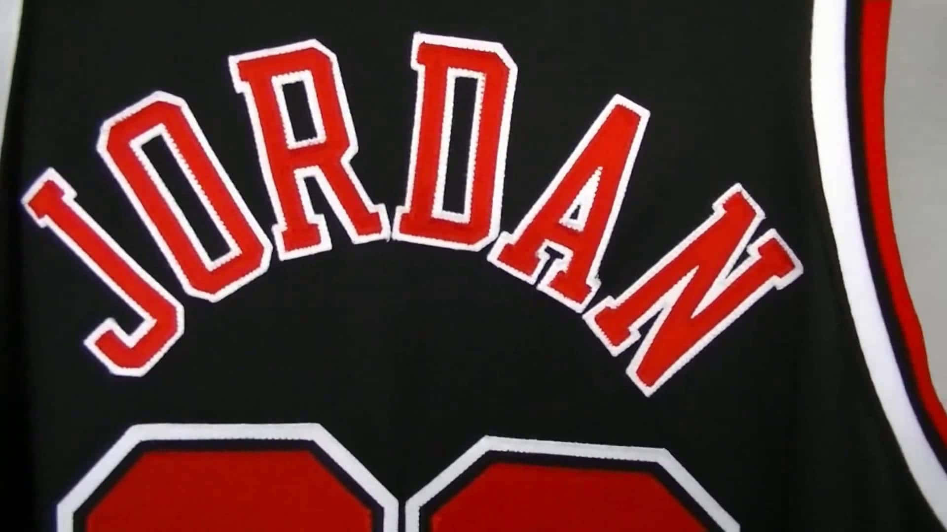 Jordan's Jersey Is Shown On A Black Background Background