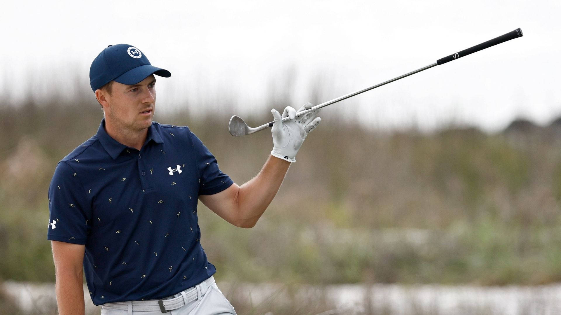 Jordan Spieth A Holding Golf Club Background