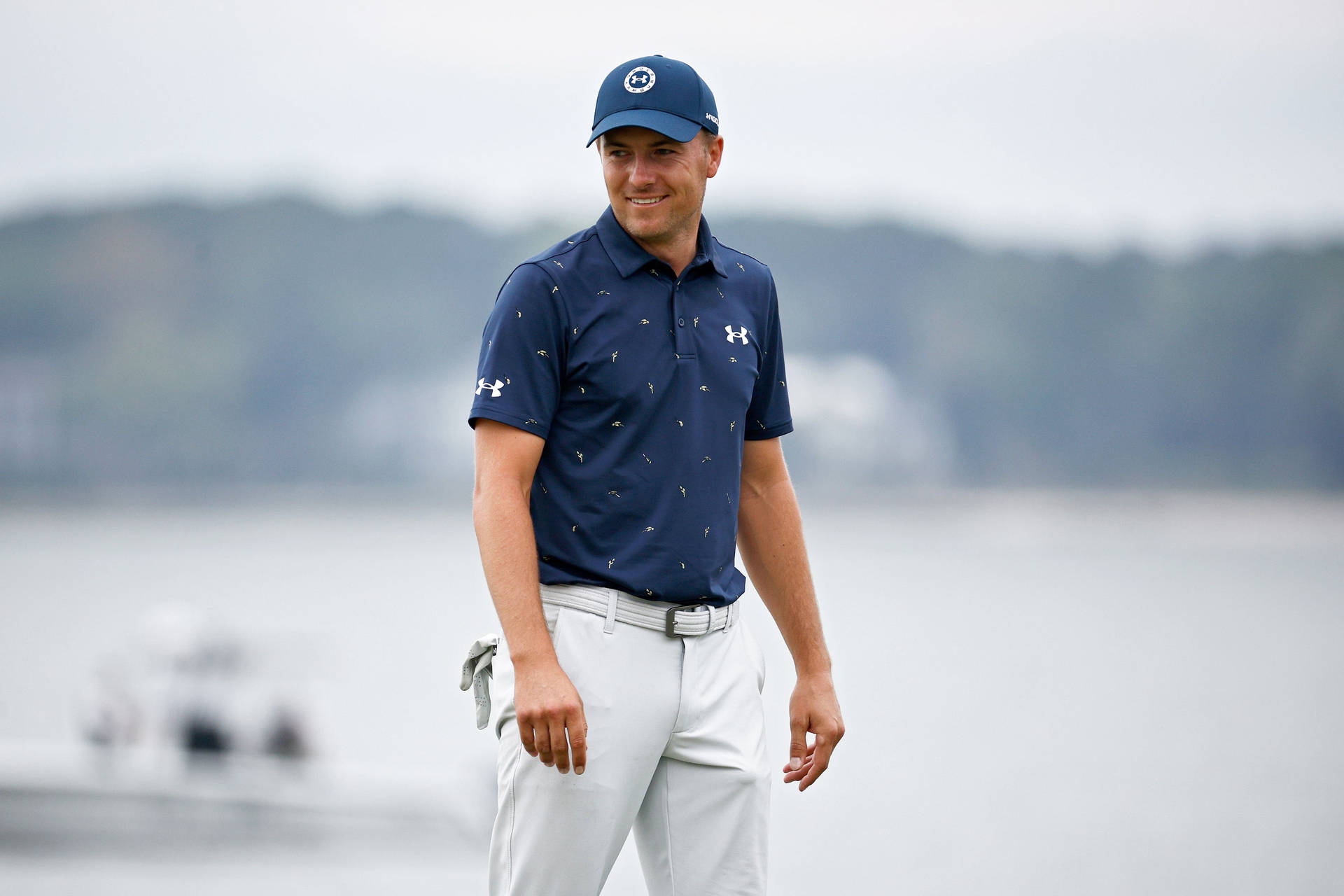 Jordan Spieth In Blue Attire Background