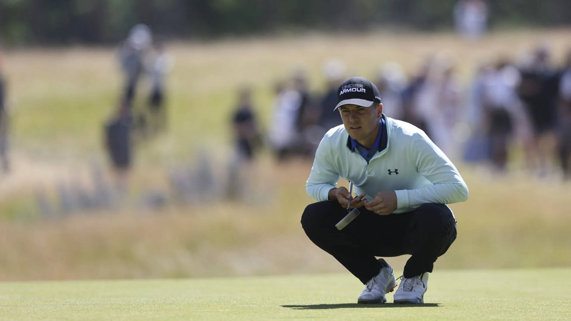 Jordan Spieth Observing The Putting Green Background