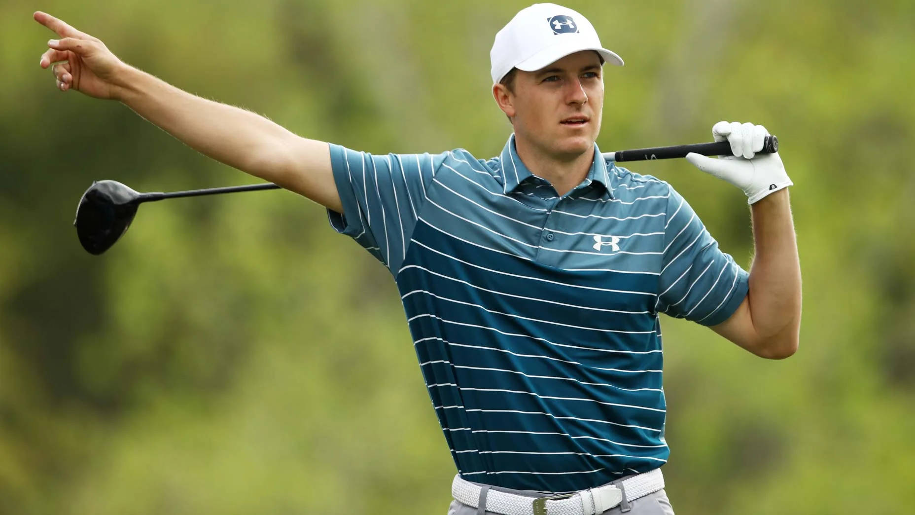 Jordan Spieth Pointing With Club Background