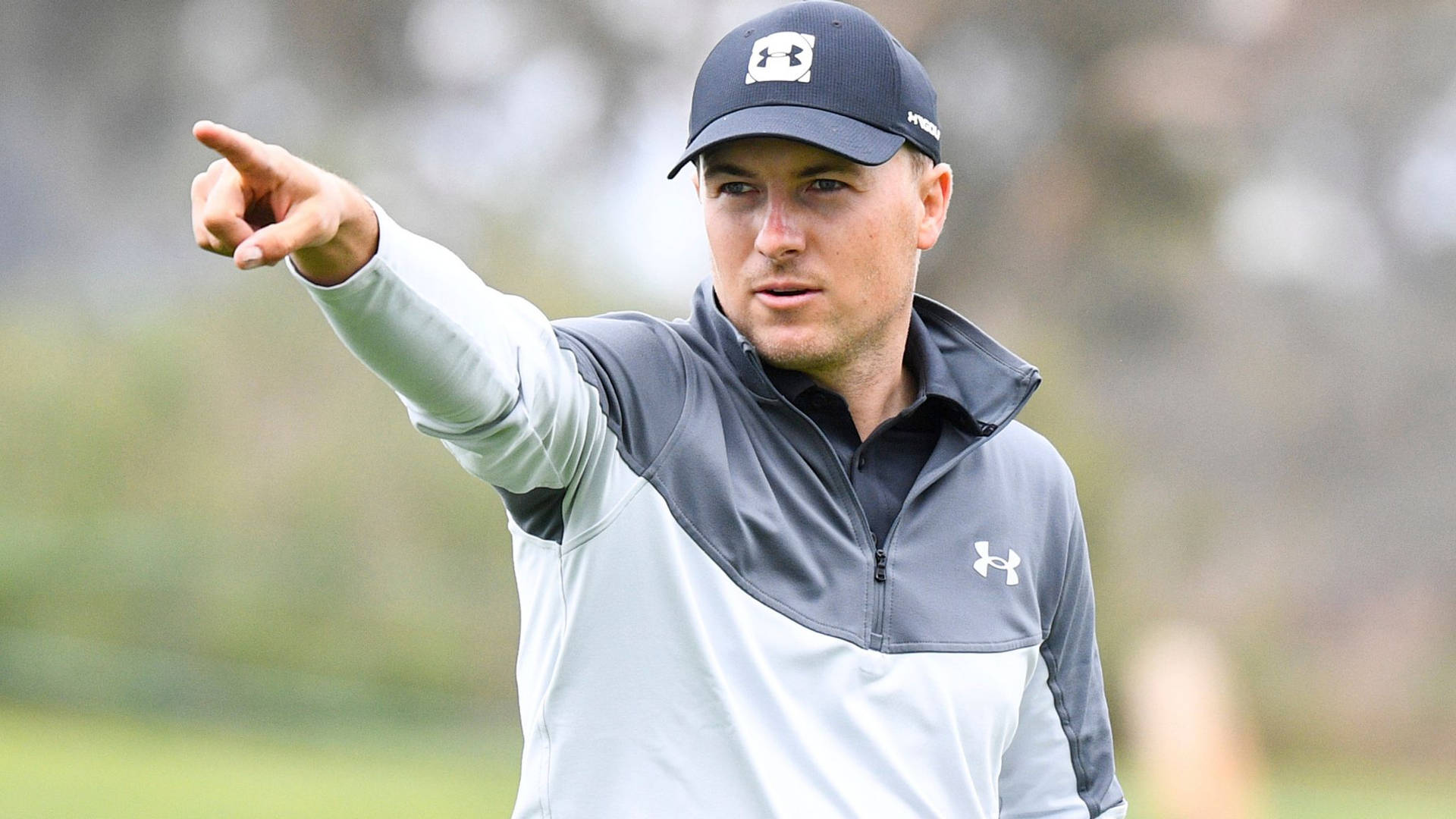 Jordan Spieth Pointing With Index Finger Background