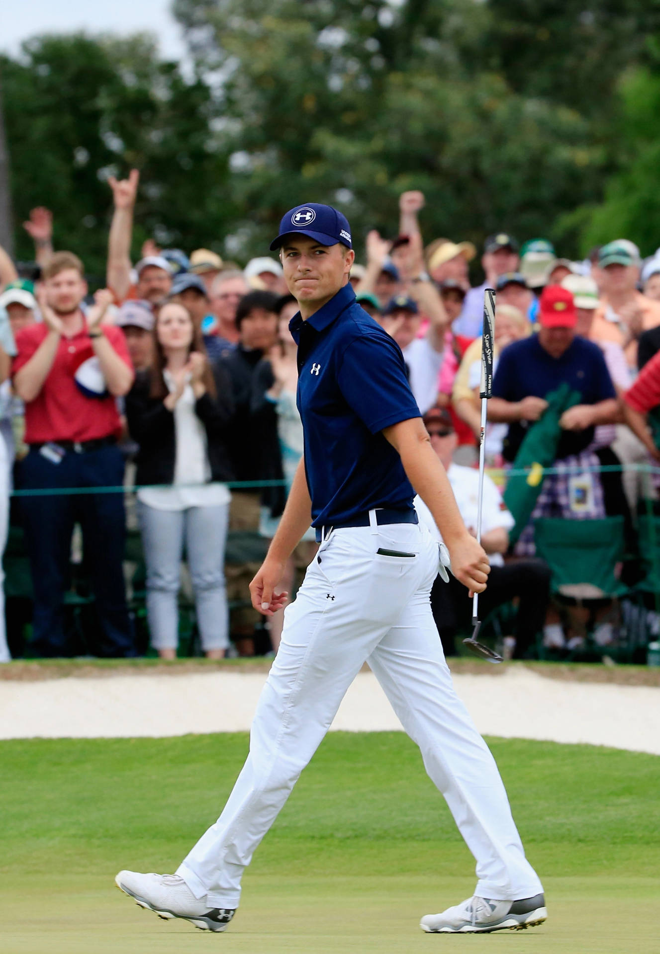 Jordan Spieth Walking Across A Field Background