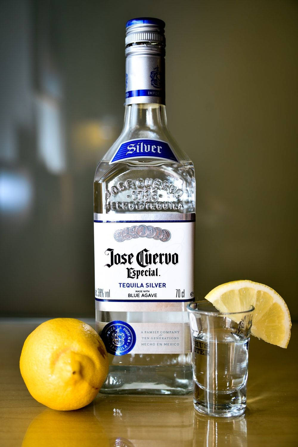 Jose Cuervo Tequila Bottle With Lemon Background