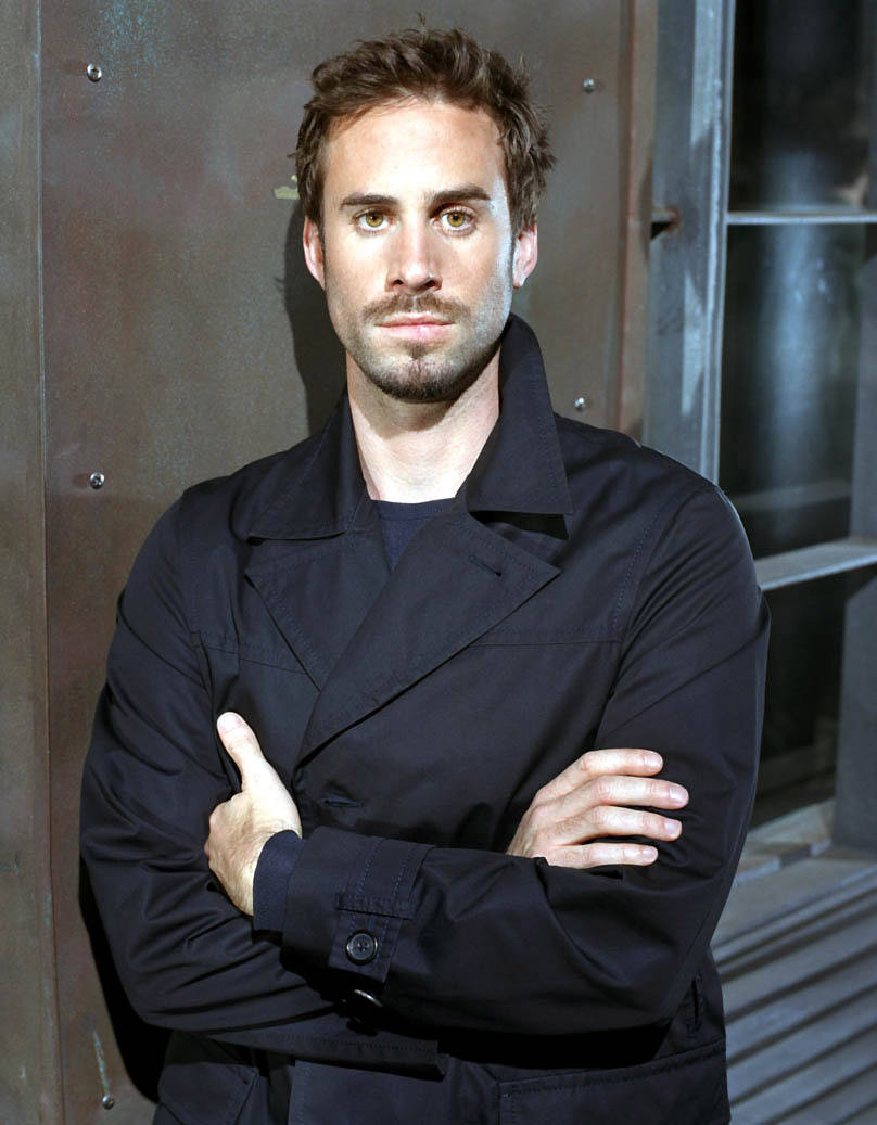 Joseph Fiennes Posing In A Black Raincoat