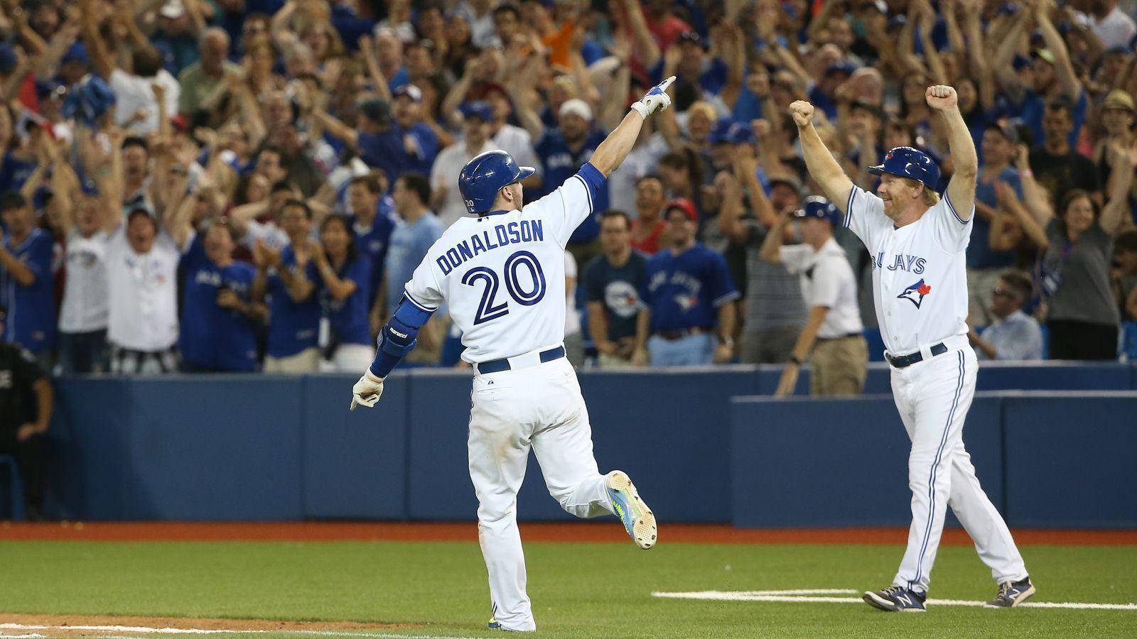 Josh Donaldson Cheers With Crowd Background