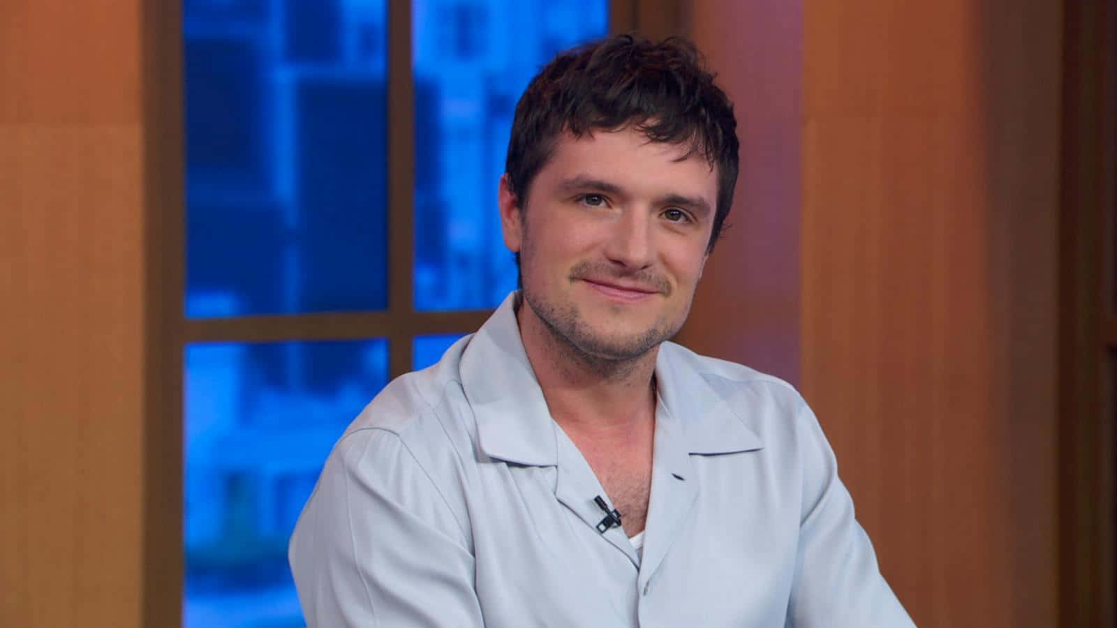 Josh Hutcherson Smiling During Interview Background