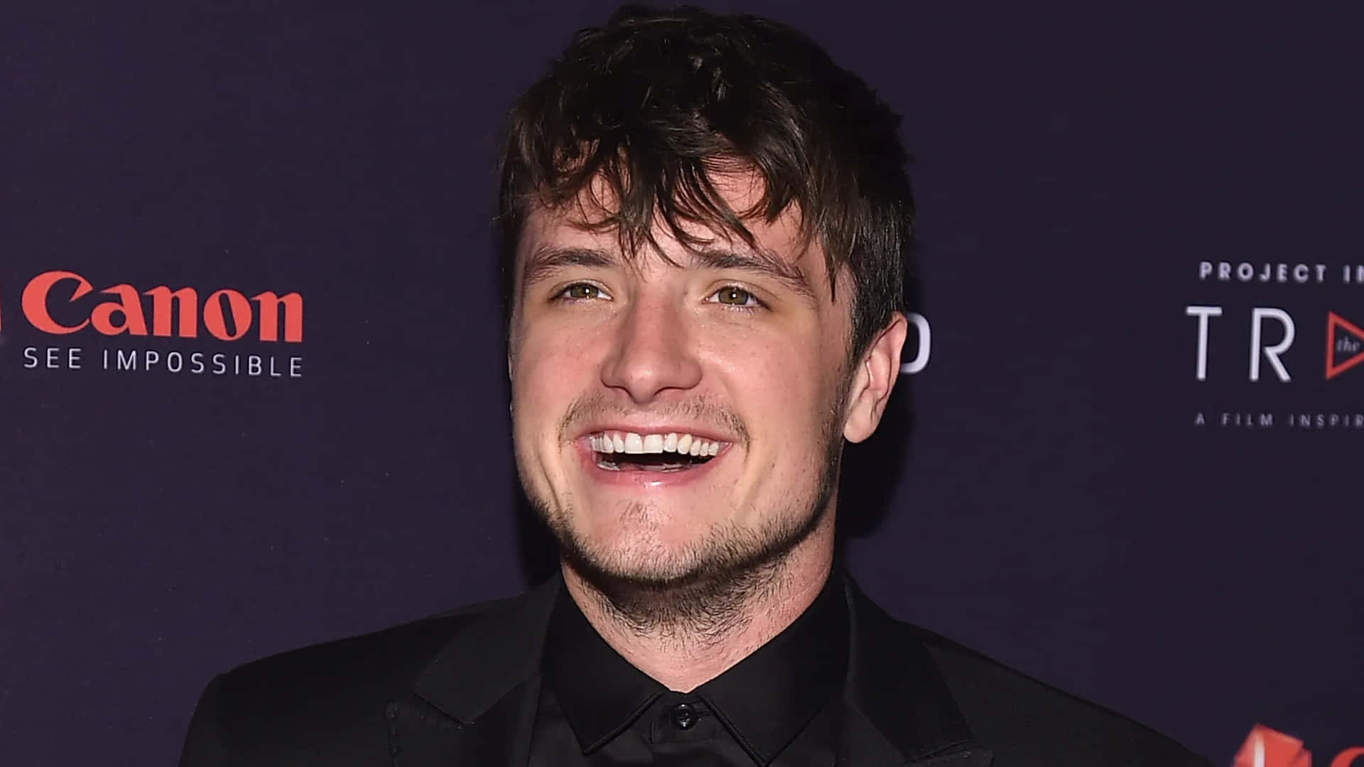 Josh Hutcherson Smilingat Event Background