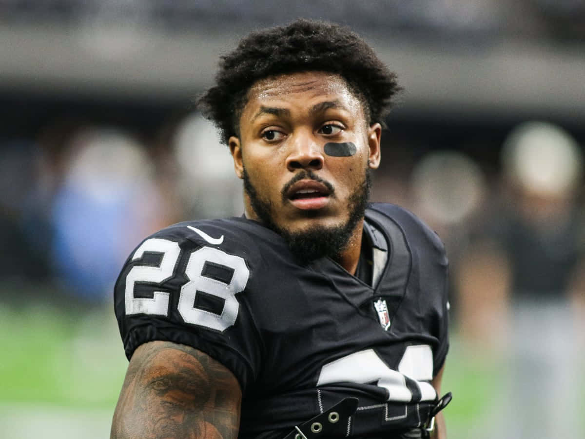 Josh Jacobs Focused Football Player