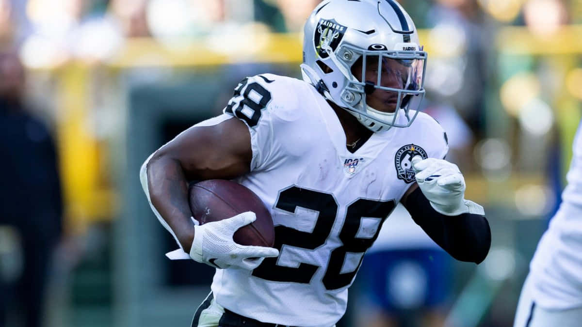 Josh Jacobs Raiders Running Back Action Background
