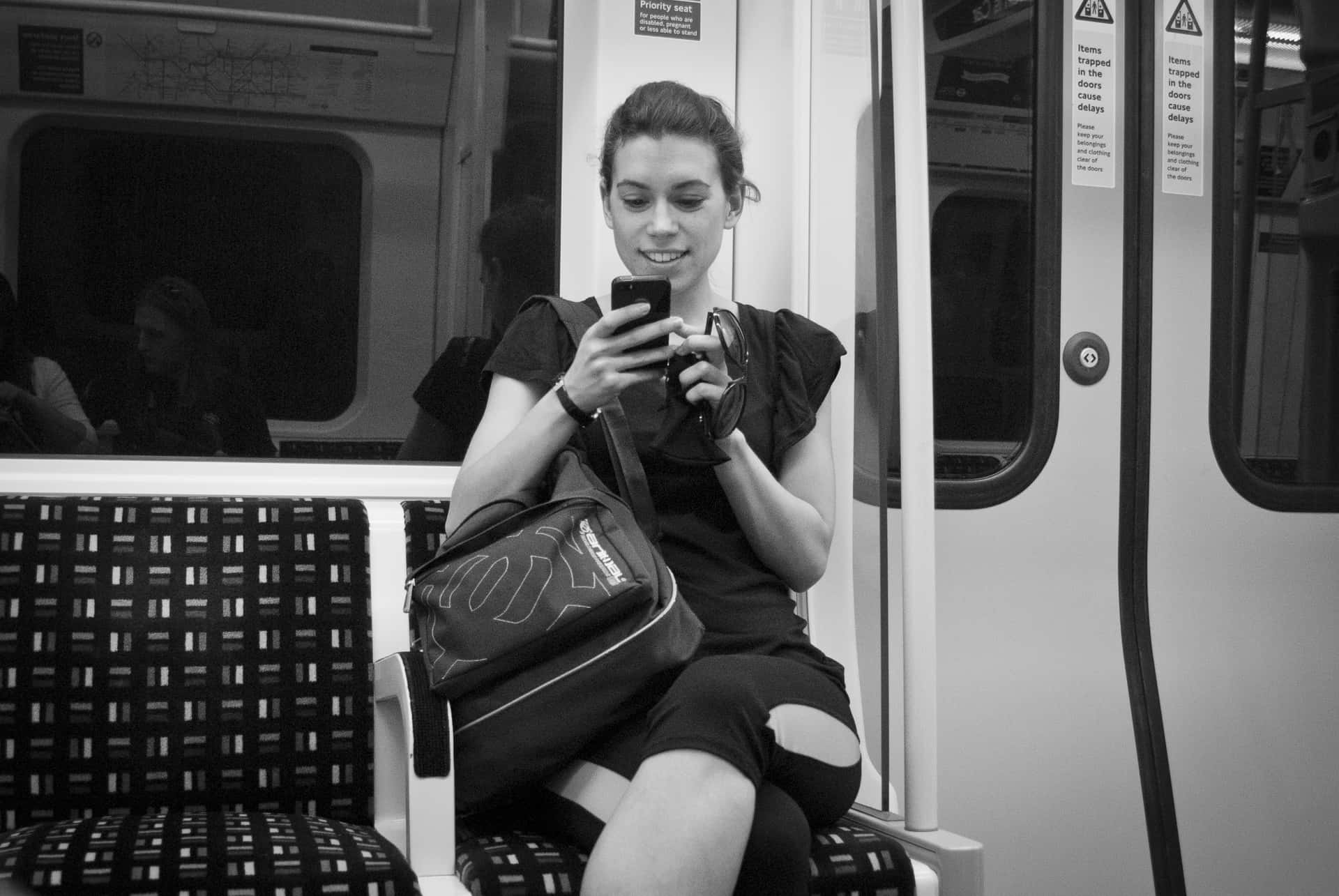 Jovial Woman Reading A Text Background