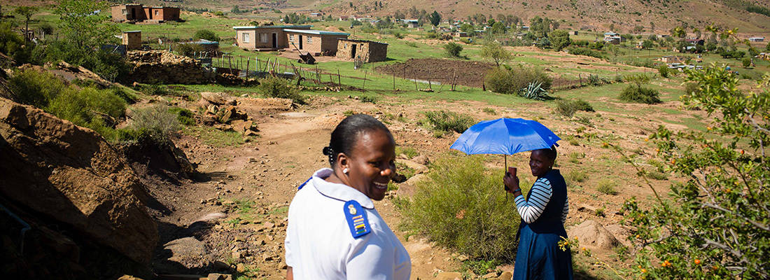 Joyful Lesotho Woman With Umbrella